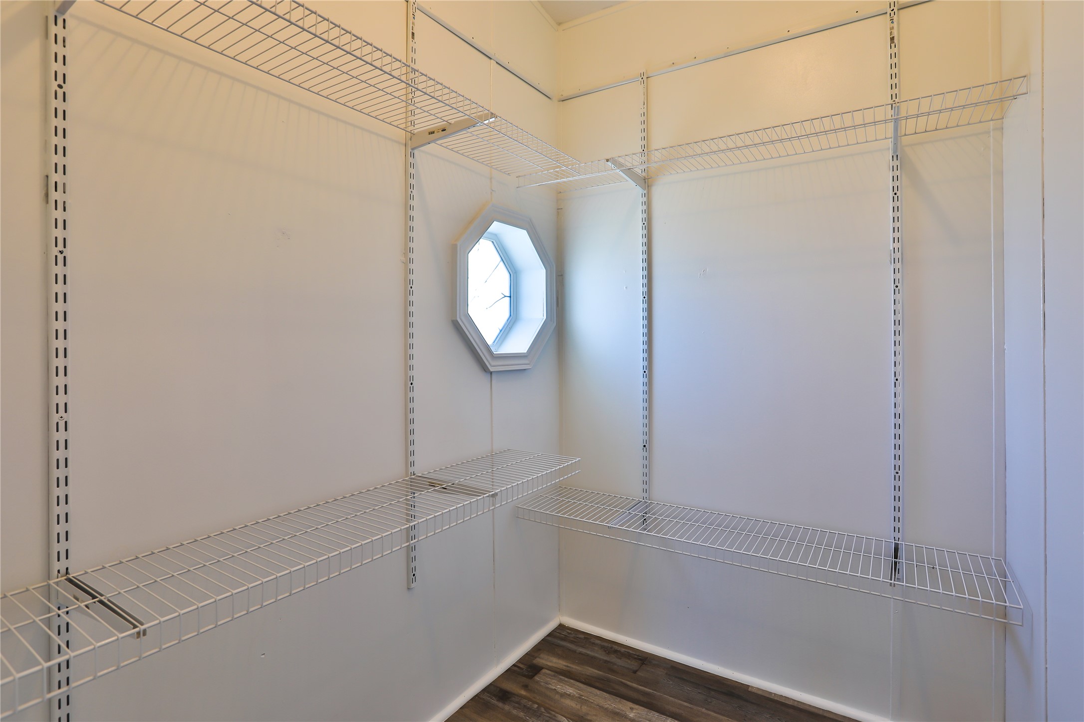 172 Kid Ranch Lane San Marcos, TX 78666 - Photo 10 of 29 Walk in closet with dark wood-style floors