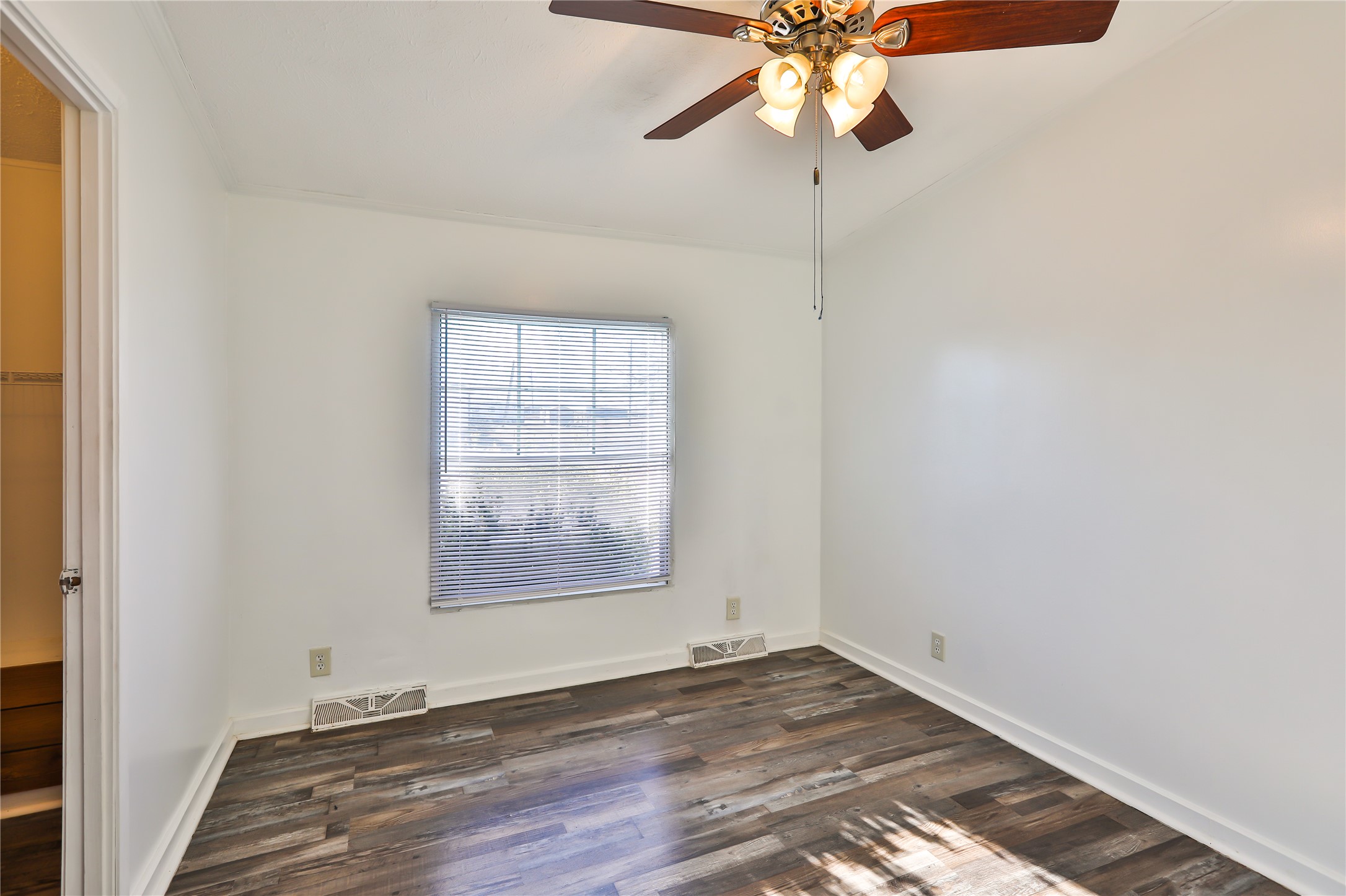 172 Kid Ranch Lane San Marcos, TX 78666 - Photo 15 of 29 Unfurnished room featuring a ceiling fan and dark wood-style flooring