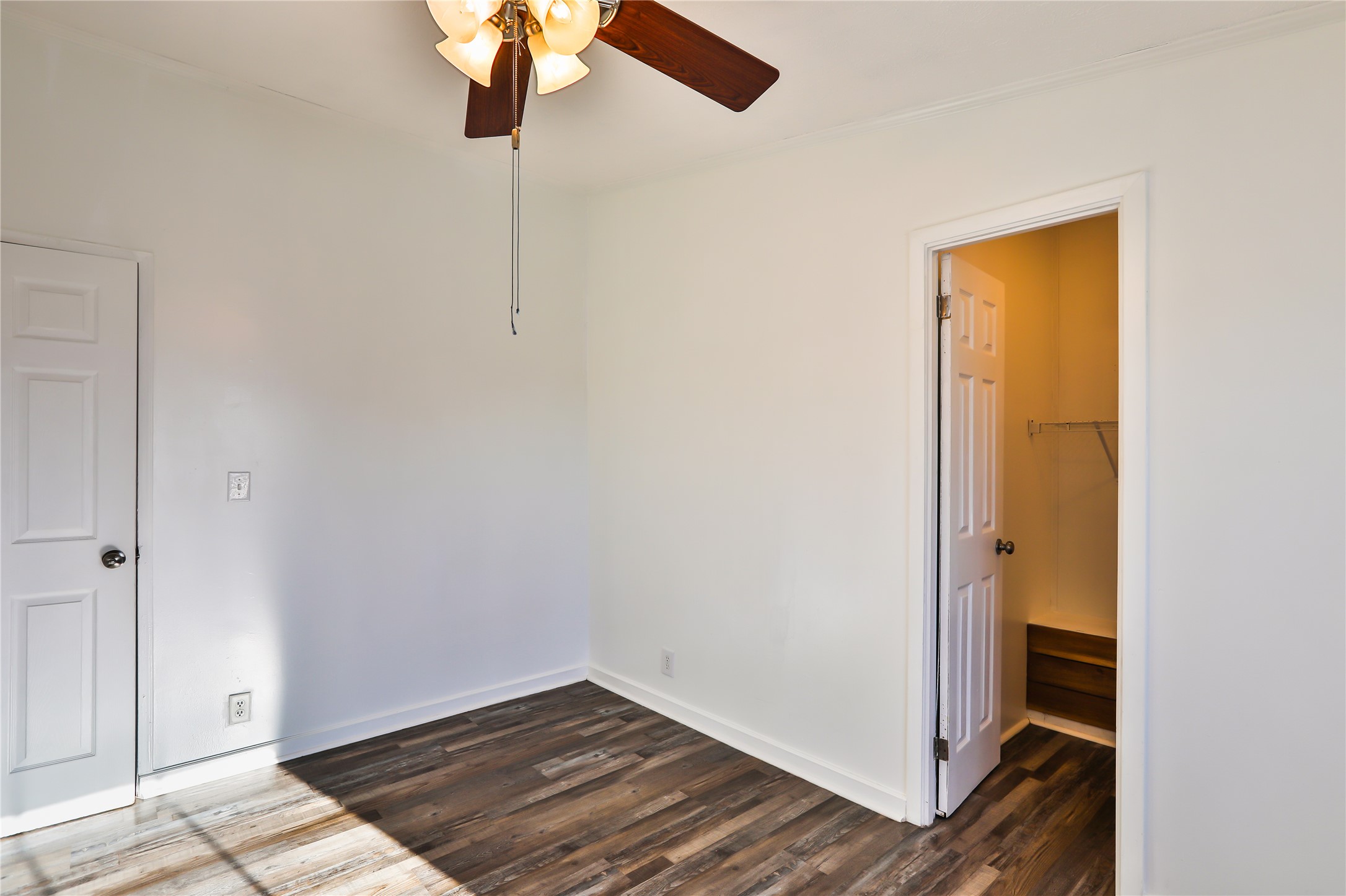 172 Kid Ranch Lane San Marcos, TX 78666 - Photo 16 of 29 Unfurnished bedroom with dark wood-type flooring and ceiling fan