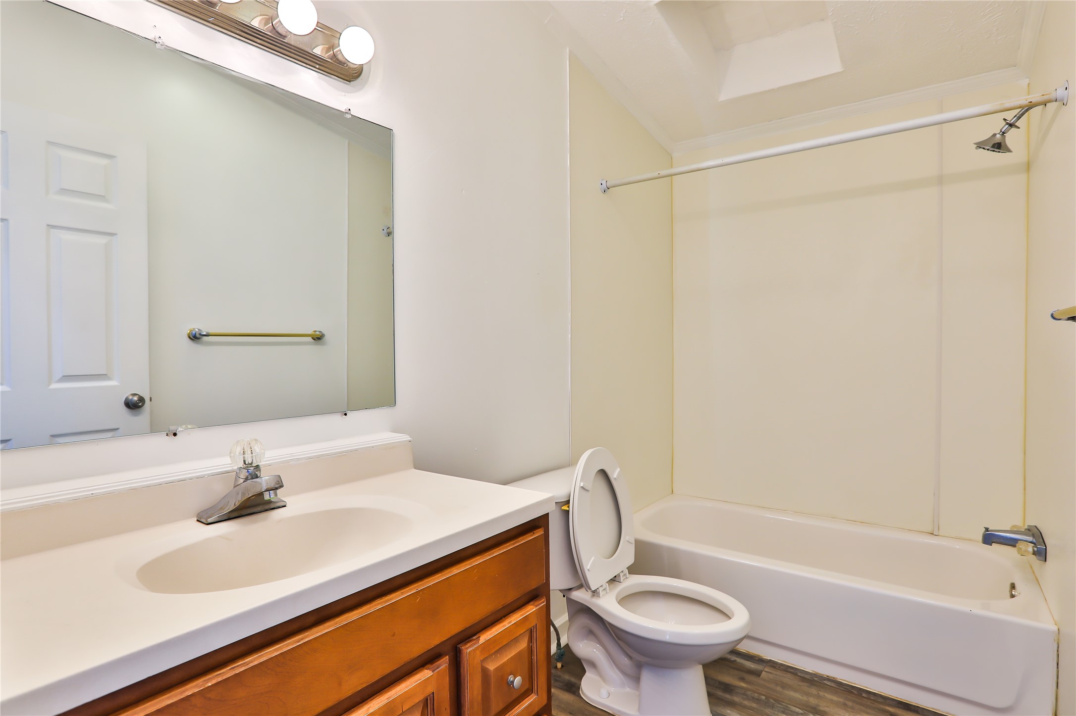 172 Kid Ranch Lane San Marcos, TX 78666 - Photo 17 of 29 Bathroom with vanity, bathtub / shower combination, and dark wood-style flooring