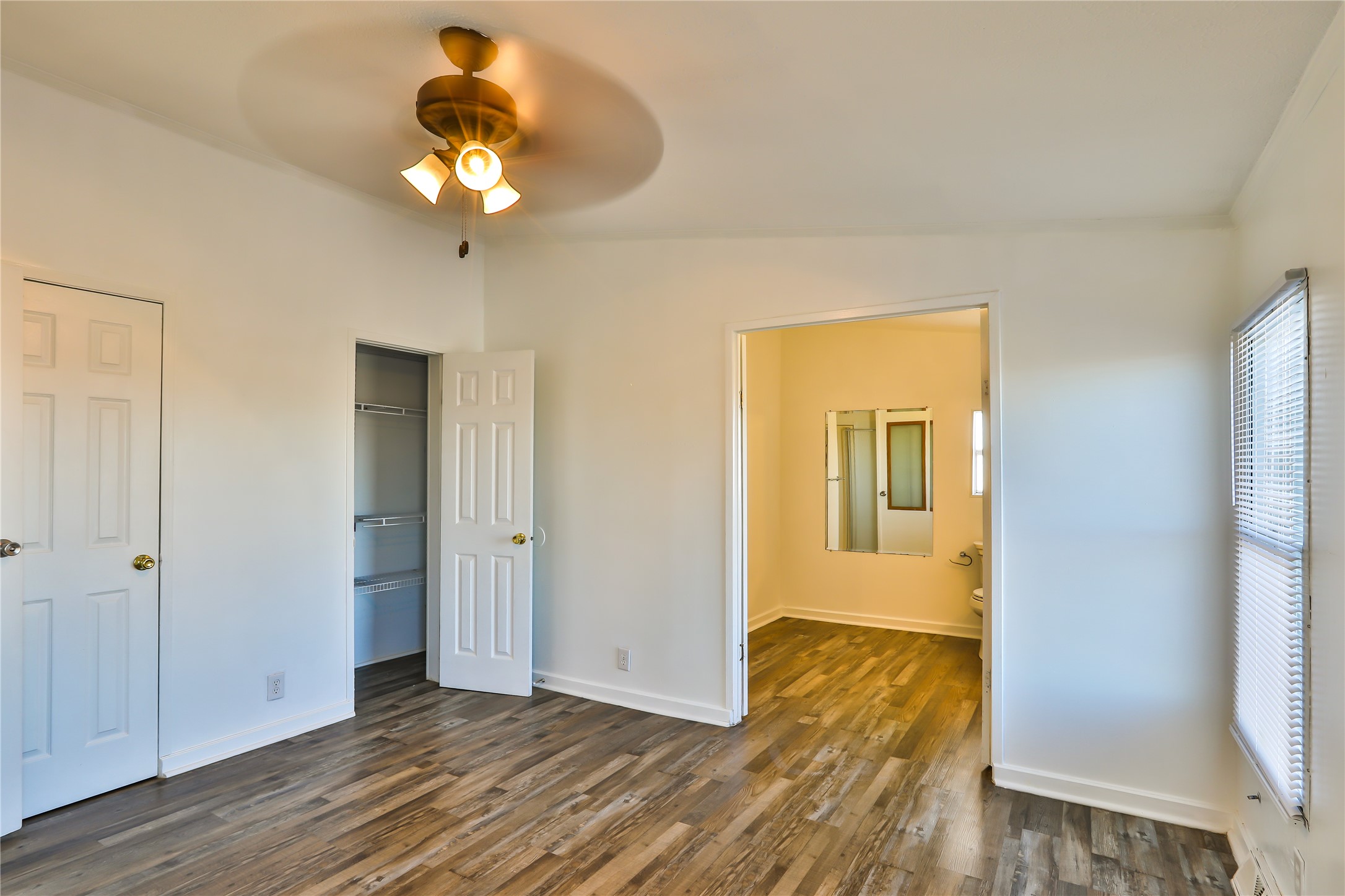 172 Kid Ranch Lane San Marcos, TX 78666 - Photo 20 of 29 Unfurnished bedroom featuring dark wood-style floors and a ceiling fan