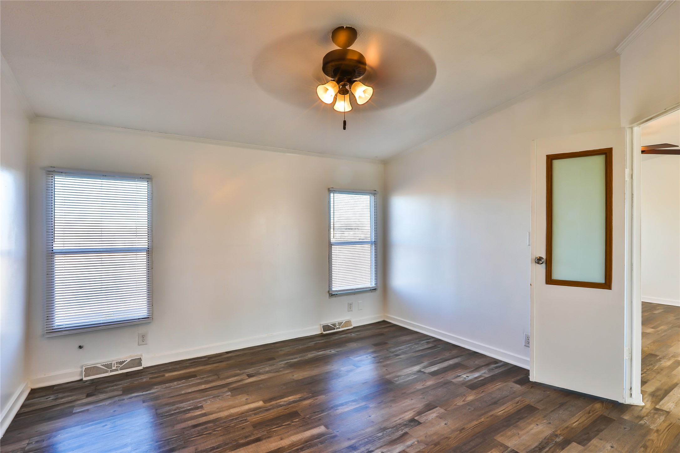 172 Kid Ranch Lane San Marcos, TX 78666 - Photo 22 of 29 Unfurnished room with ceiling fan, dark wood-style flooring, and ornamental molding