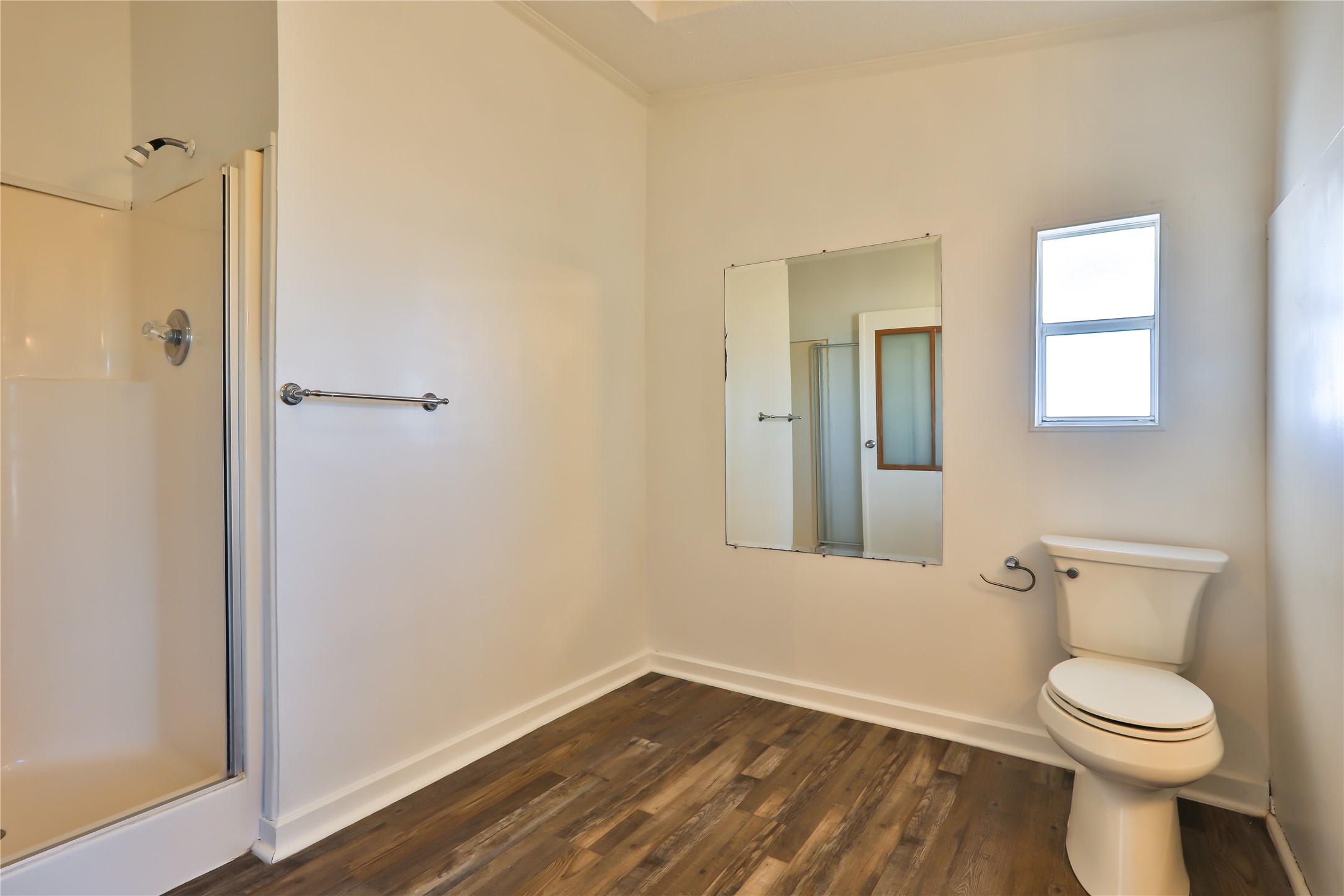 172 Kid Ranch Lane San Marcos, TX 78666 - Photo 23 of 29 Full bathroom featuring a stall shower and dark wood finished floors