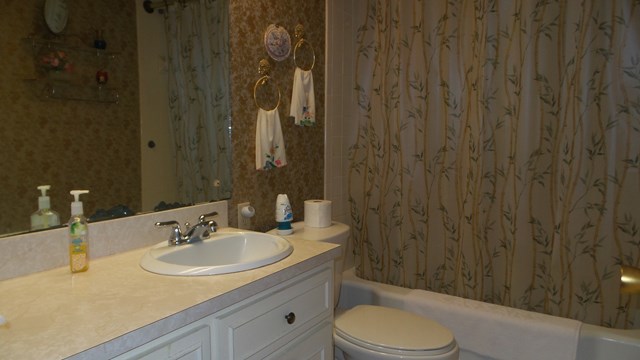 3585 Forrest Road Columbus, GA 31907 - Photo 18 of 21 a bathroom with a sink toilet and shower