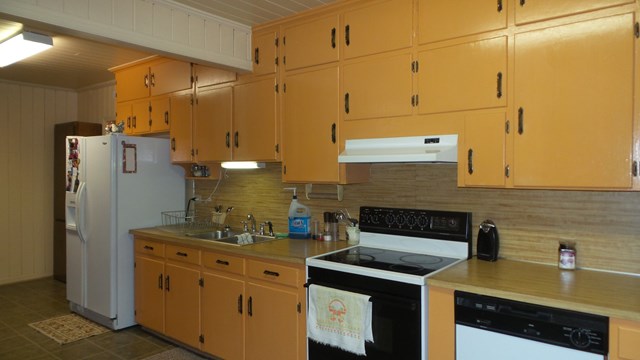 3585 Forrest Road Columbus, GA 31907 - Photo 7 of 21 a kitchen with stainless steel appliances granite countertop a sink and cabinets