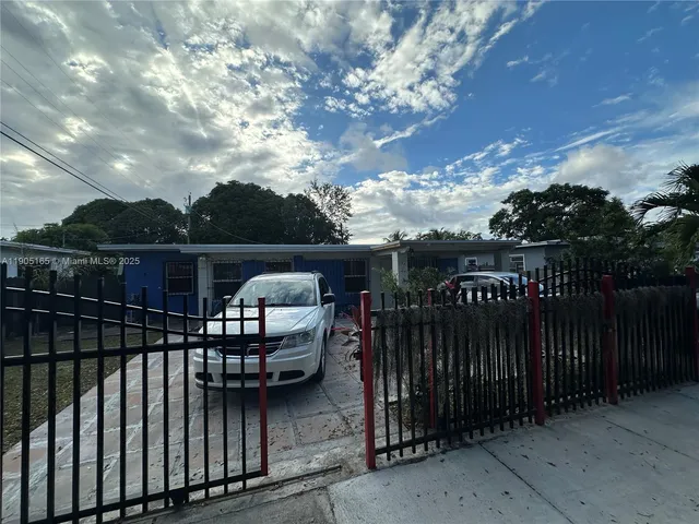 a view of a roof deck with wooden fence