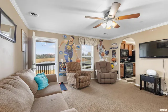 a bedroom with furniture and a flat screen tv