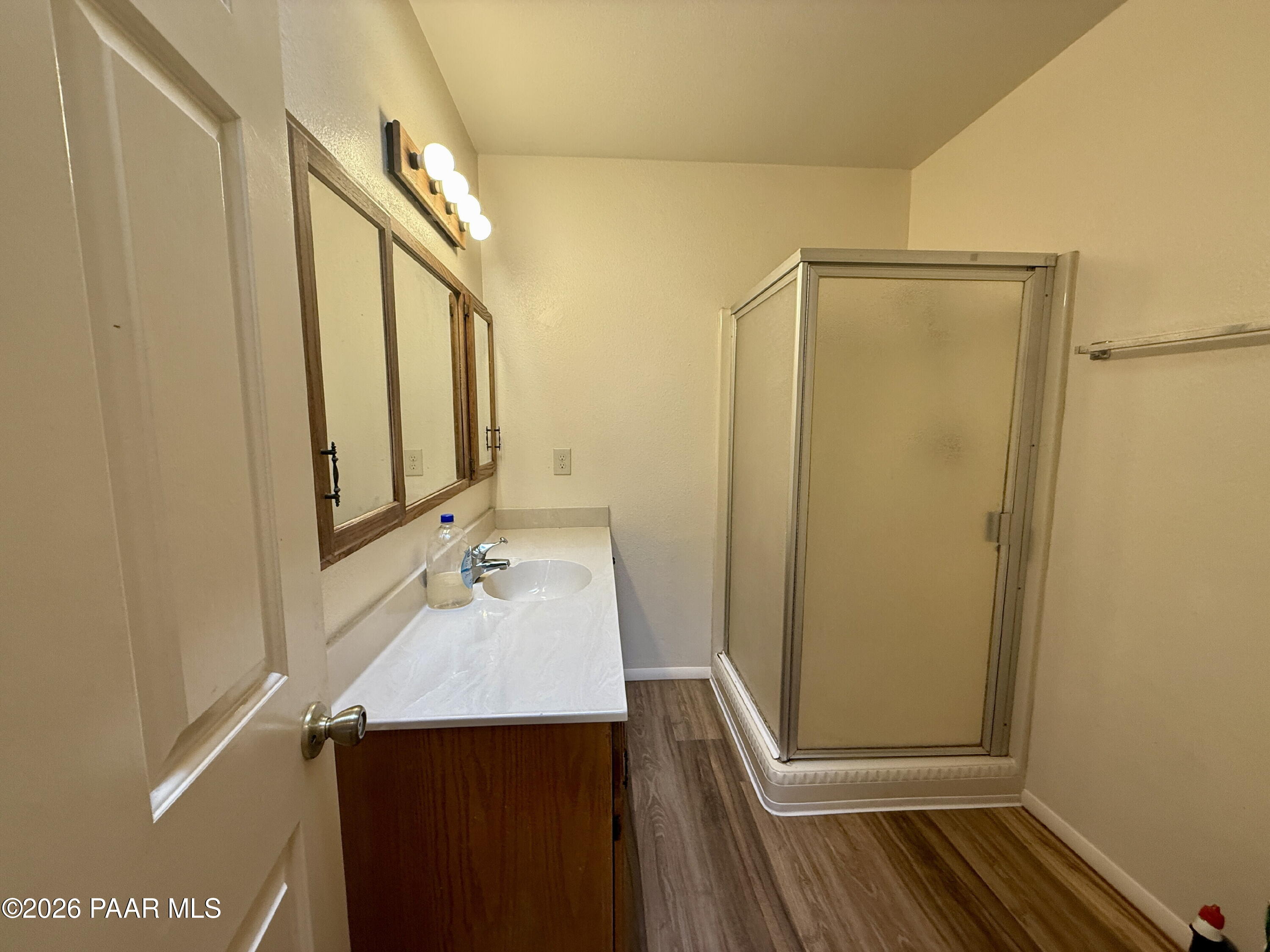 350 Rim Rock Circle, Unit 2 Prescott, AZ 86303 - Photo 12 of 14 a bathroom with a sink and a mirror