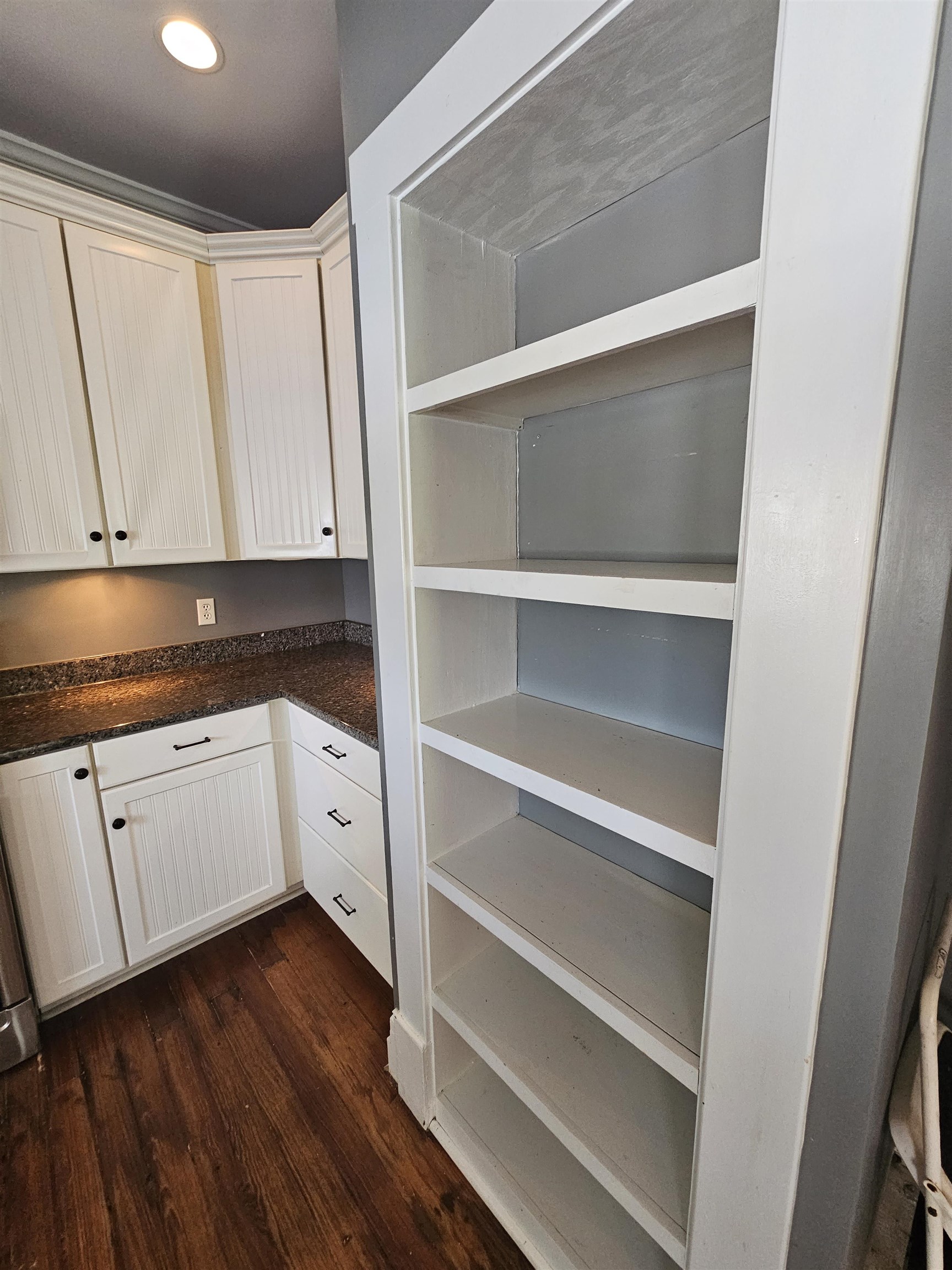 2964 Spring Hill Road Staunton, VA 24401 - Photo 31 of 71 a kitchen with wooden floors wooden cabinets and white appliances