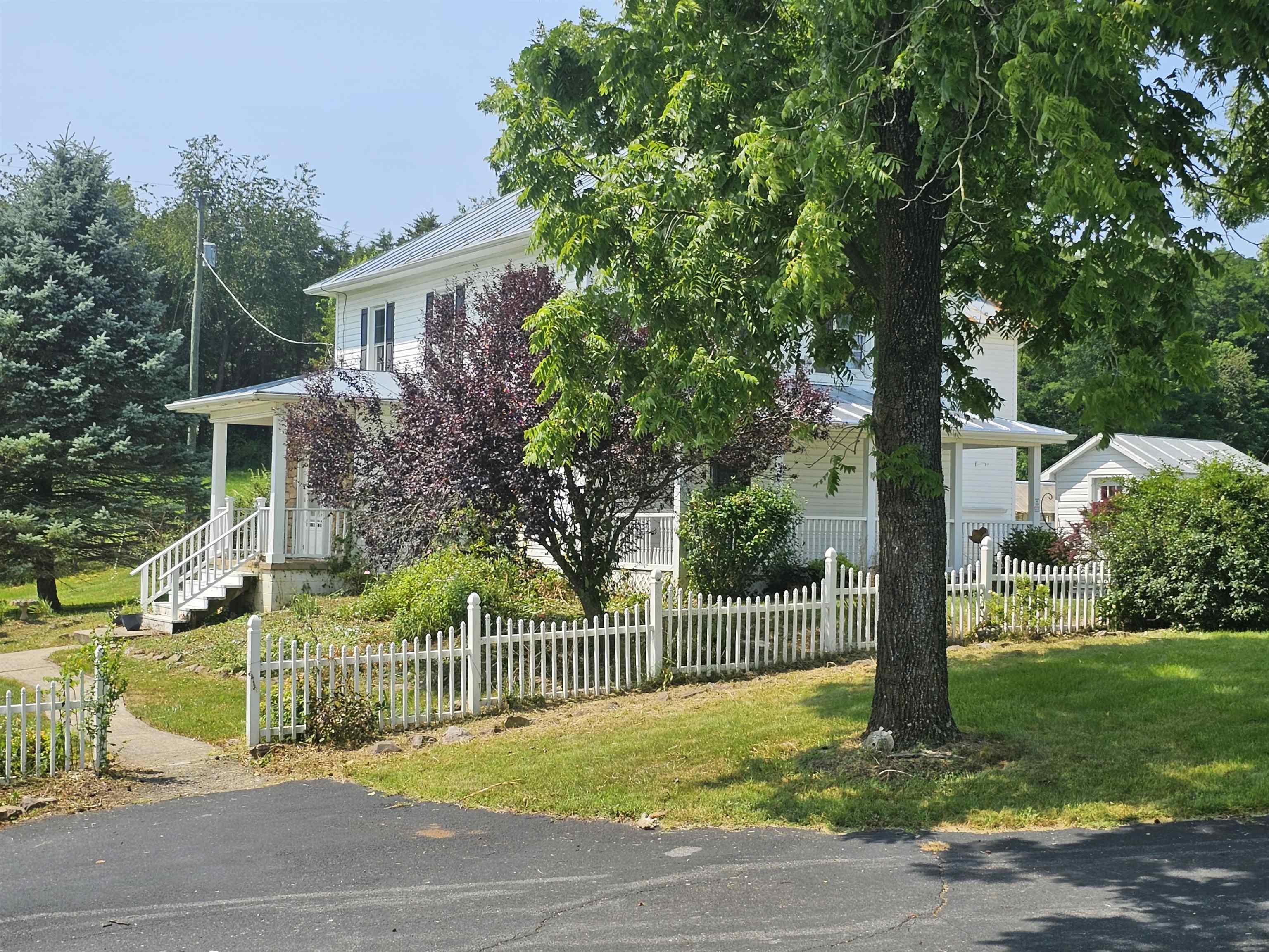 2964 Spring Hill Road Staunton, VA 24401 - Photo 54 of 71 a view of a house with a small yard and plants