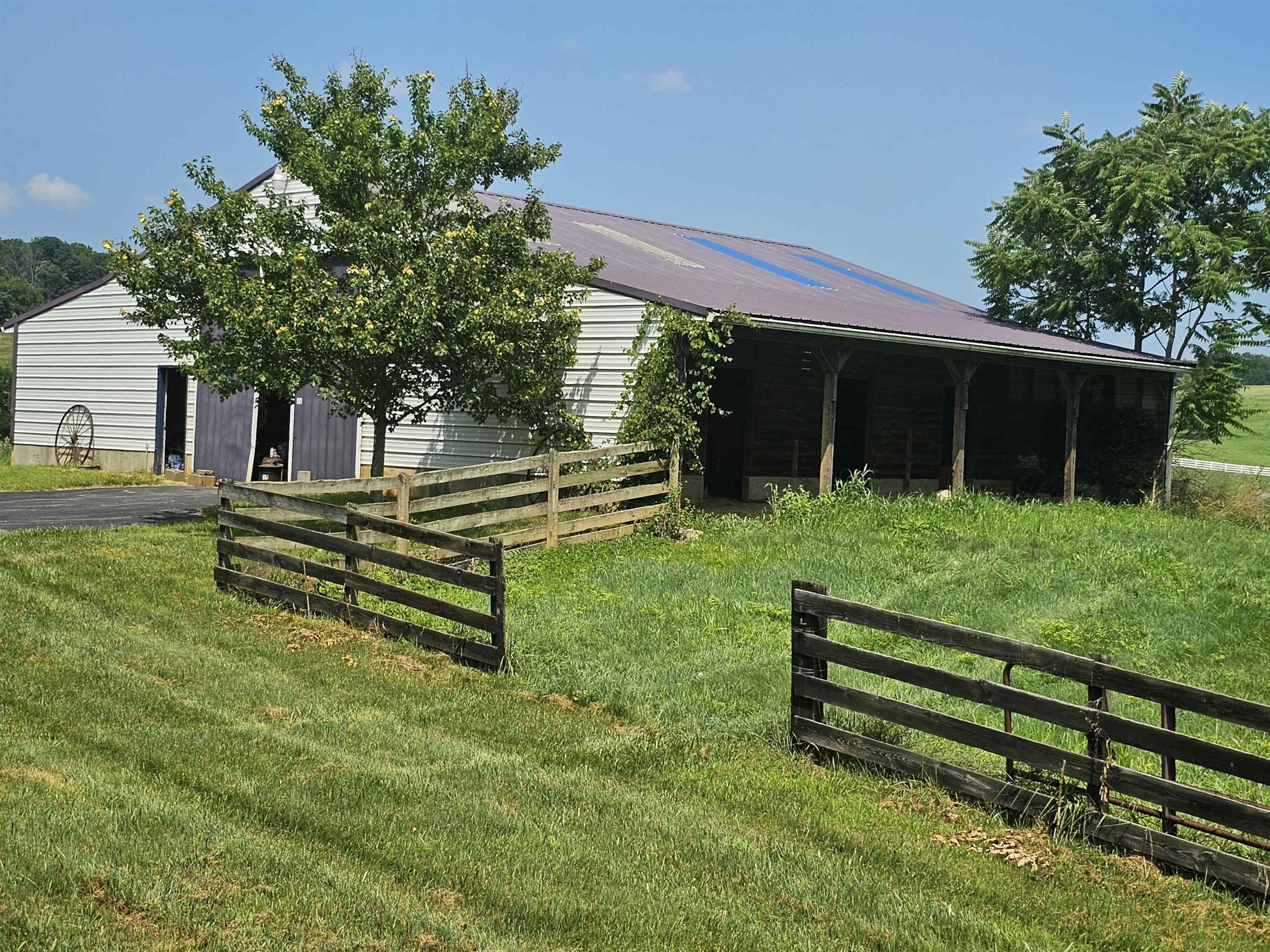 2964 Spring Hill Road Staunton, VA 24401 - Photo 10 of 71 a backyard of a house with wooden floor and fence