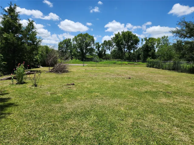 a view of outdoor space with deck and yard