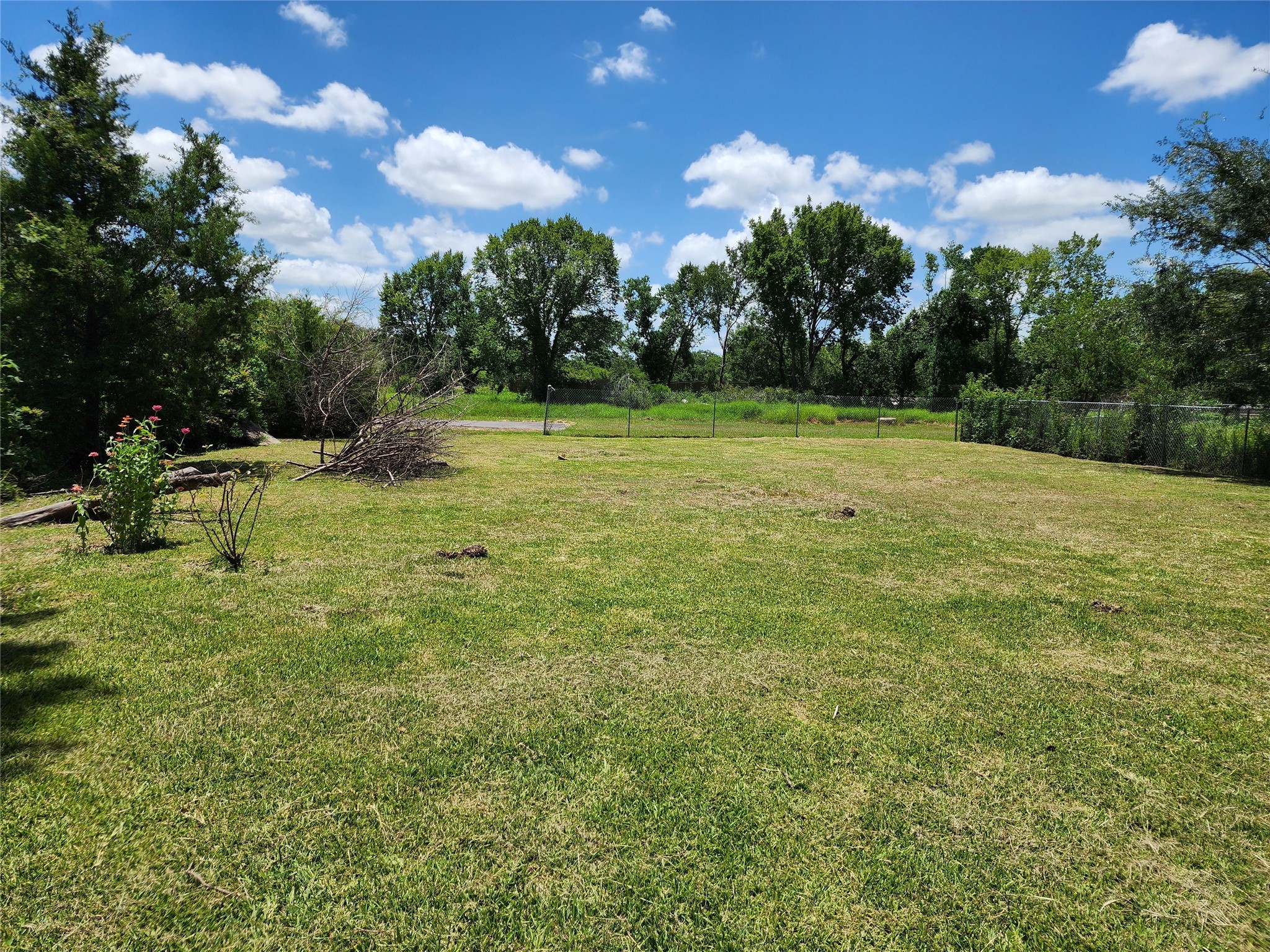 a view of outdoor space with deck and yard