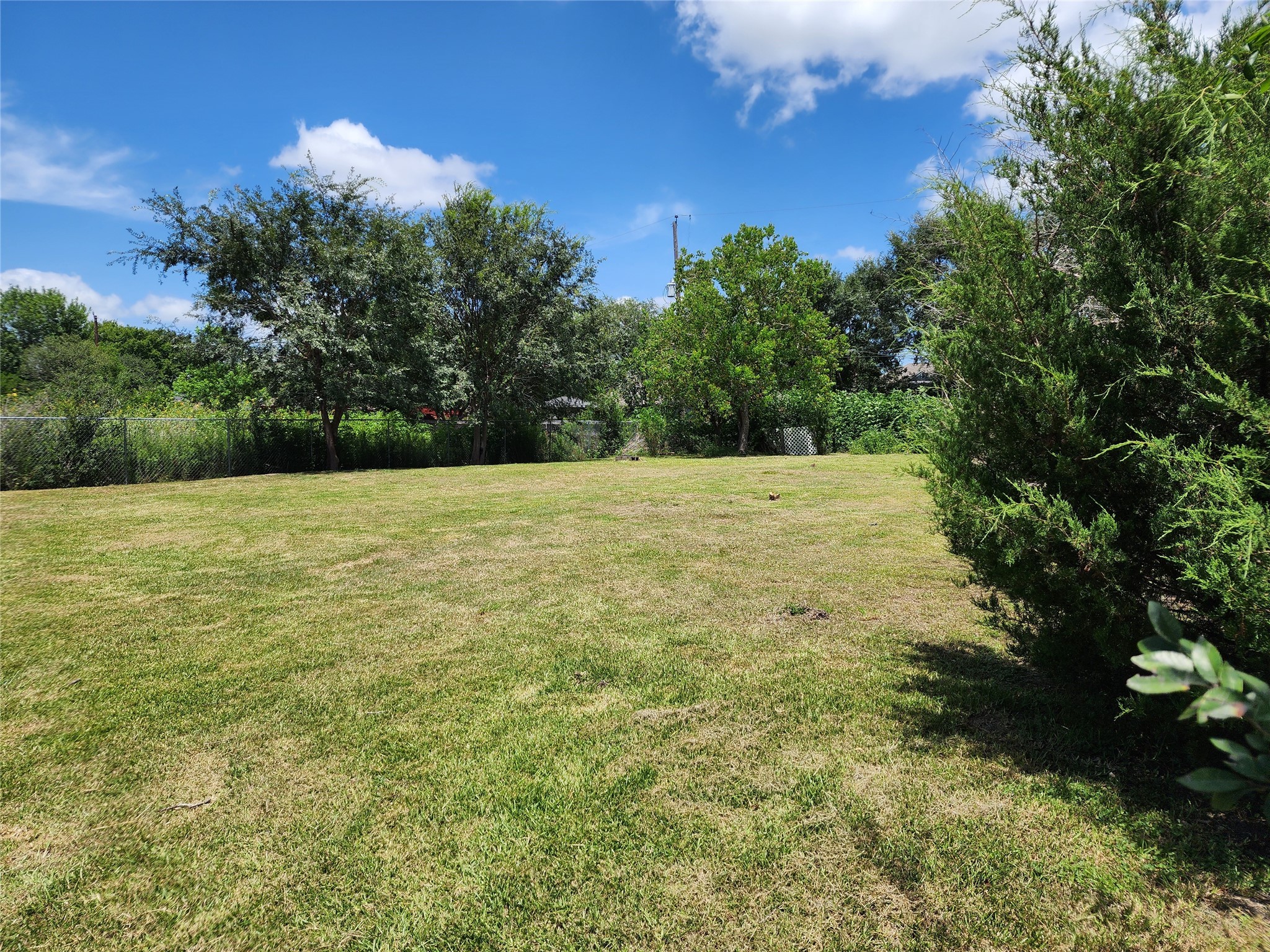 0 Rice Avenue Rosharon, TX 77583 - Photo 2 of 9 a view of an outdoor space and a yard