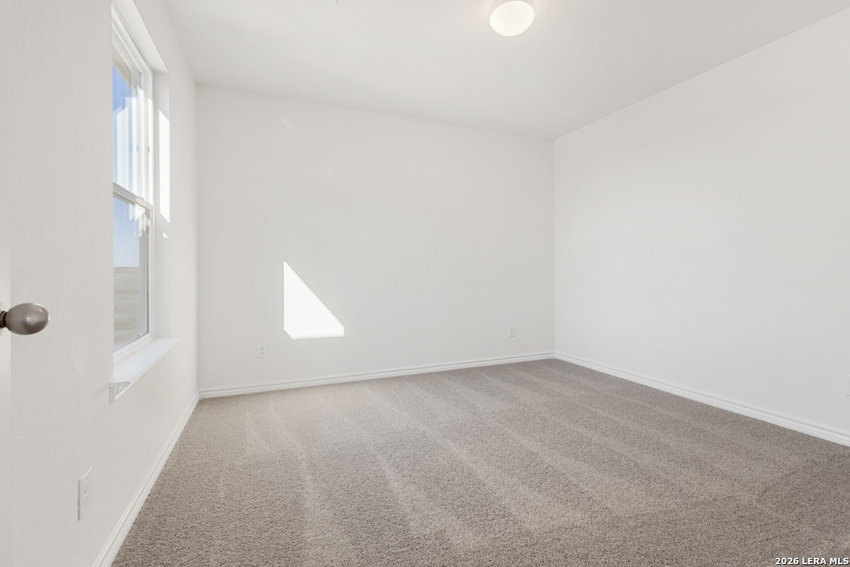 10045 Jagger Avenue Converse, TX 78109 - Photo 23 of 28 an empty room with a window