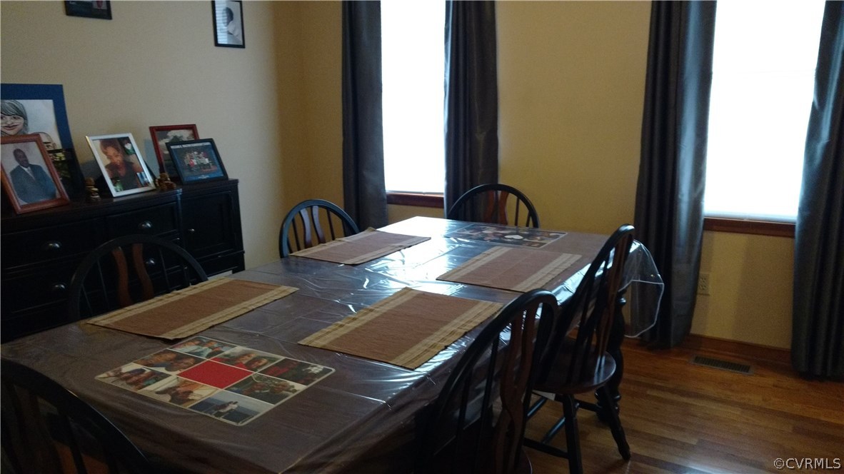 7412 Trailing Rock Road Prince George, VA 23875 - Photo 7 of 22 a view of a dining room with furniture