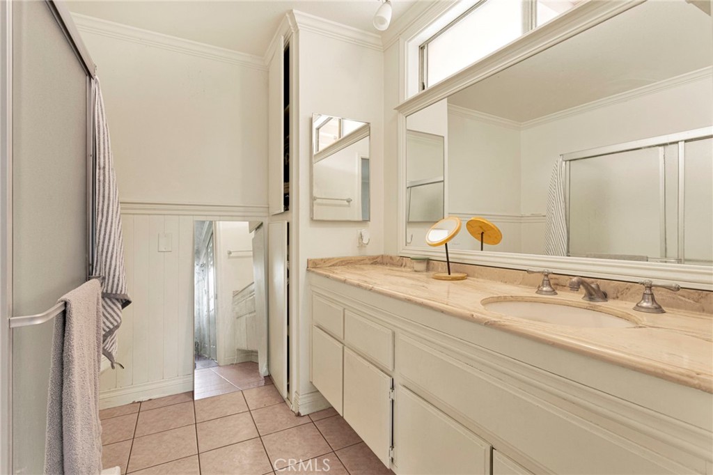 1087 Baseline Road La Verne, CA 91750 - Photo 24 of 39 a bathroom with a sink and a mirror