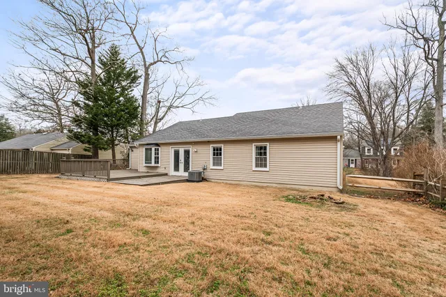 a front view of house with yard and trees