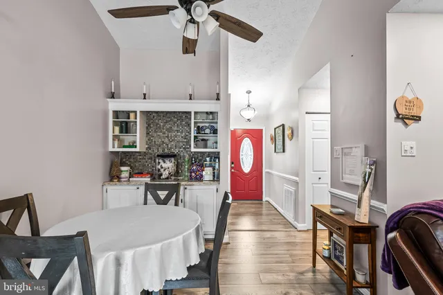 a dining room with furniture and window