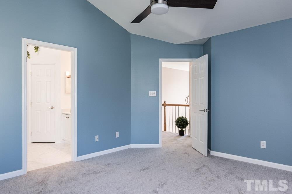 12212 Amoretto Way Raleigh, NC 27613 - Photo 15 of 30 a view of a room with wooden floor and windows