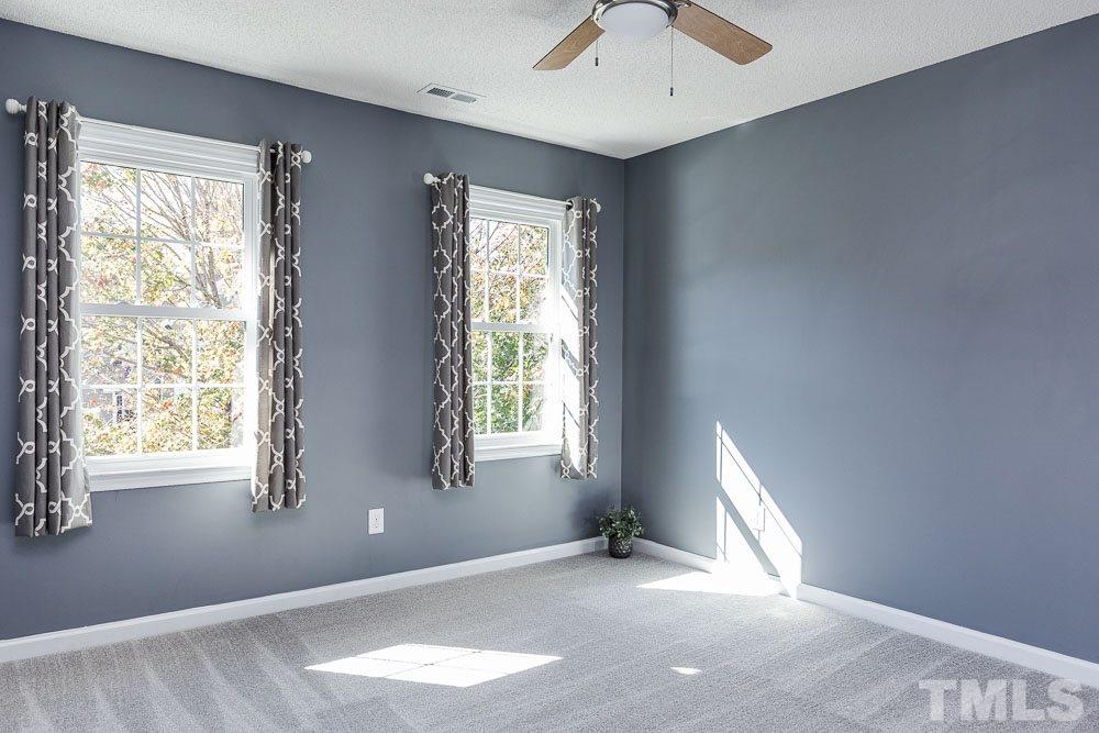 12212 Amoretto Way Raleigh, NC 27613 - Photo 18 of 30 an empty room with windows