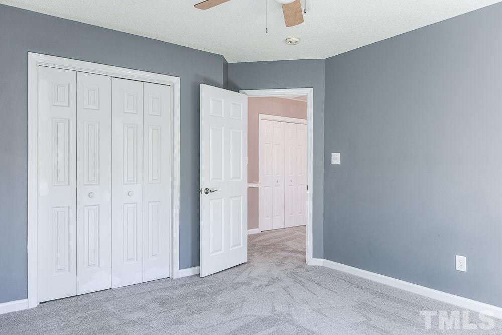 12212 Amoretto Way Raleigh, NC 27613 - Photo 19 of 30 an empty room with closet area
