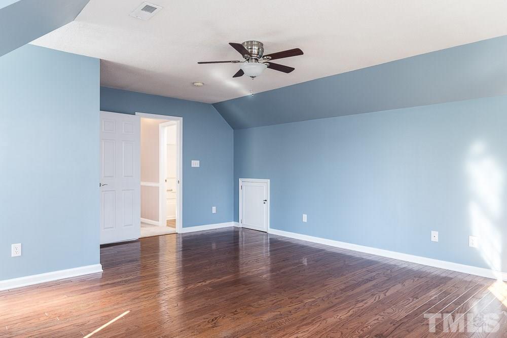 12212 Amoretto Way Raleigh, NC 27613 - Photo 24 of 30 wooden floor in an empty room with a window