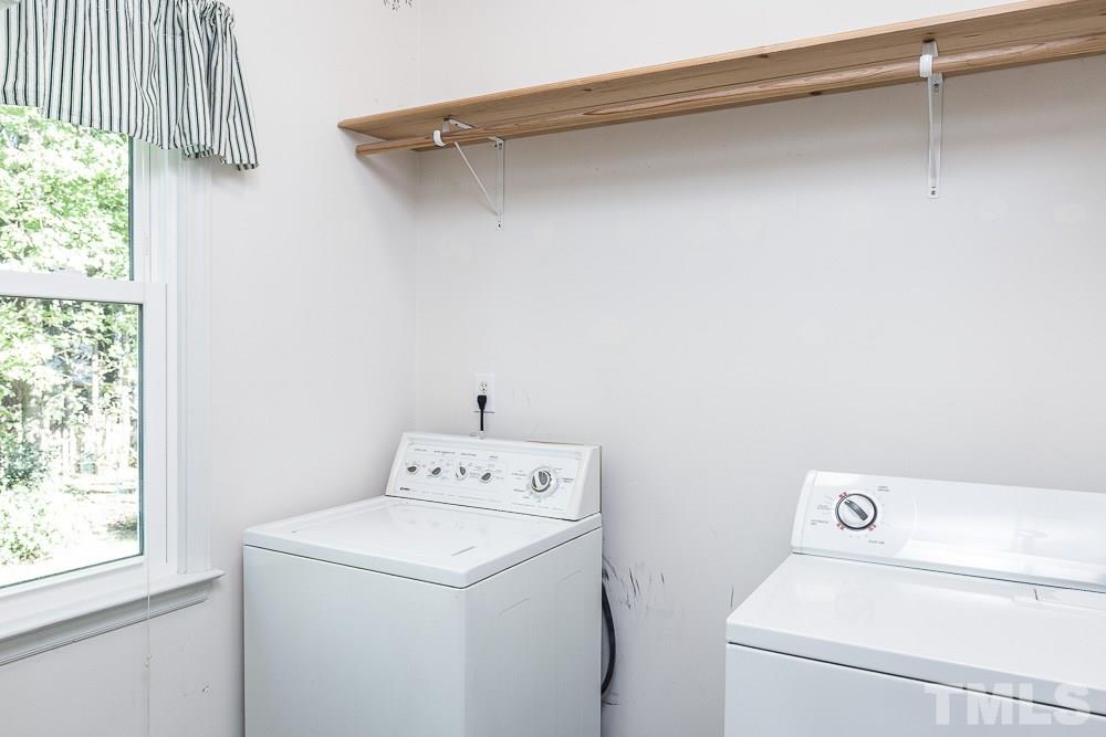 12212 Amoretto Way Raleigh, NC 27613 - Photo 25 of 30 a utility room with dryer and washer