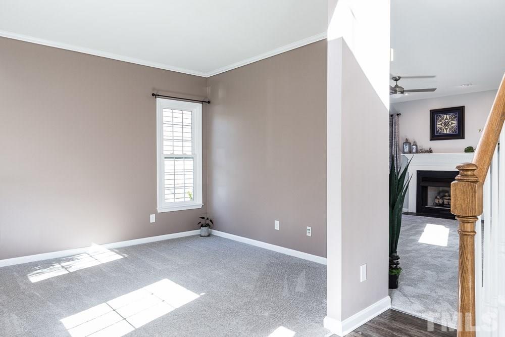 12212 Amoretto Way Raleigh, NC 27613 - Photo 4 of 30 a view of a room with a fireplace