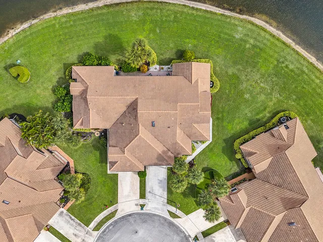 a front view of a house with a yard table and chairs