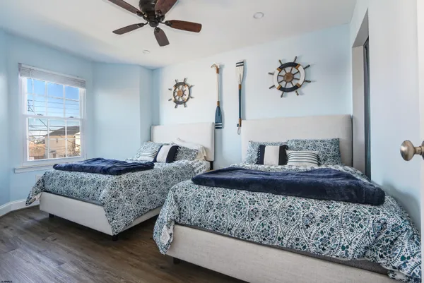 a bedroom with a large bed and a window