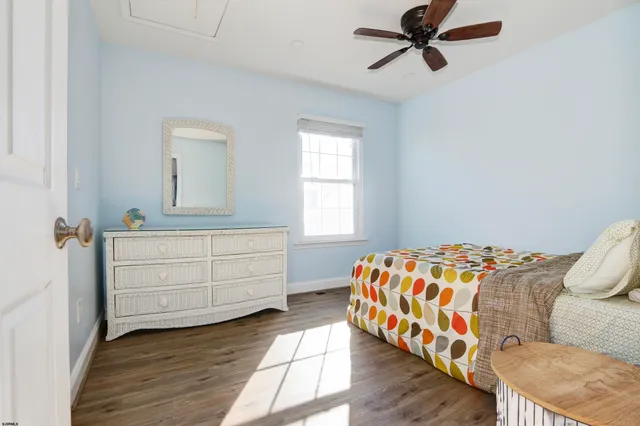 a bedroom with a bed and a dresser