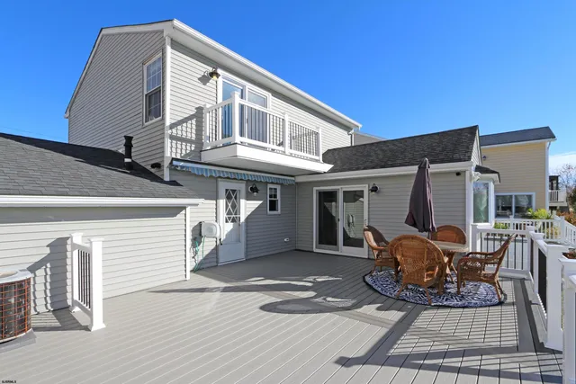 a view of house with patio porch and furniture
