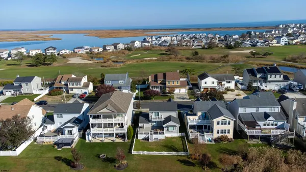 an aerial view of a houses with outdoor space