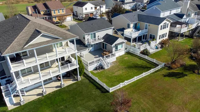an aerial view of residential house with outdoor space and swimming pool