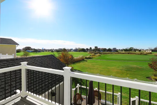a view of a balcony with city