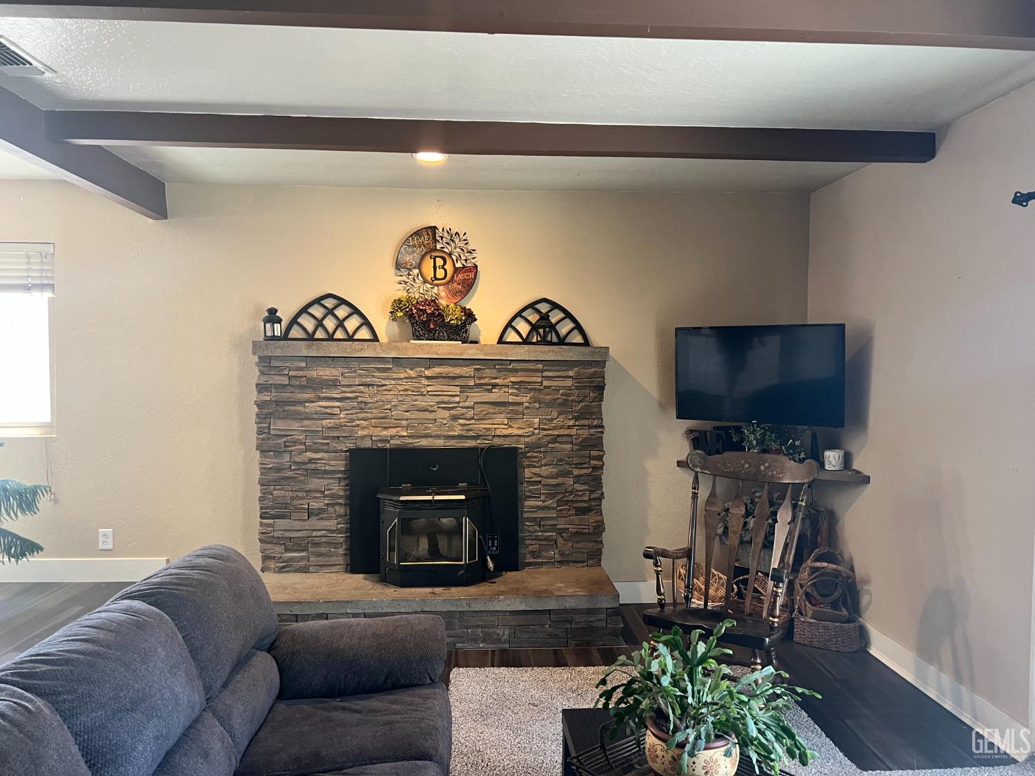 Undisclosed Address Tehachapi, CA 93561 - Photo 12 of 22 a living room with furniture a potted plant and a fireplace
