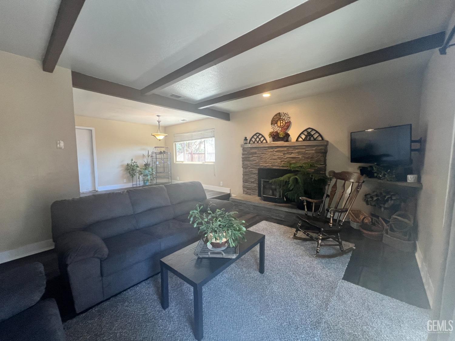 Undisclosed Address Tehachapi, CA 93561 - Photo 13 of 22 a living room with furniture a fireplace and a flat screen tv