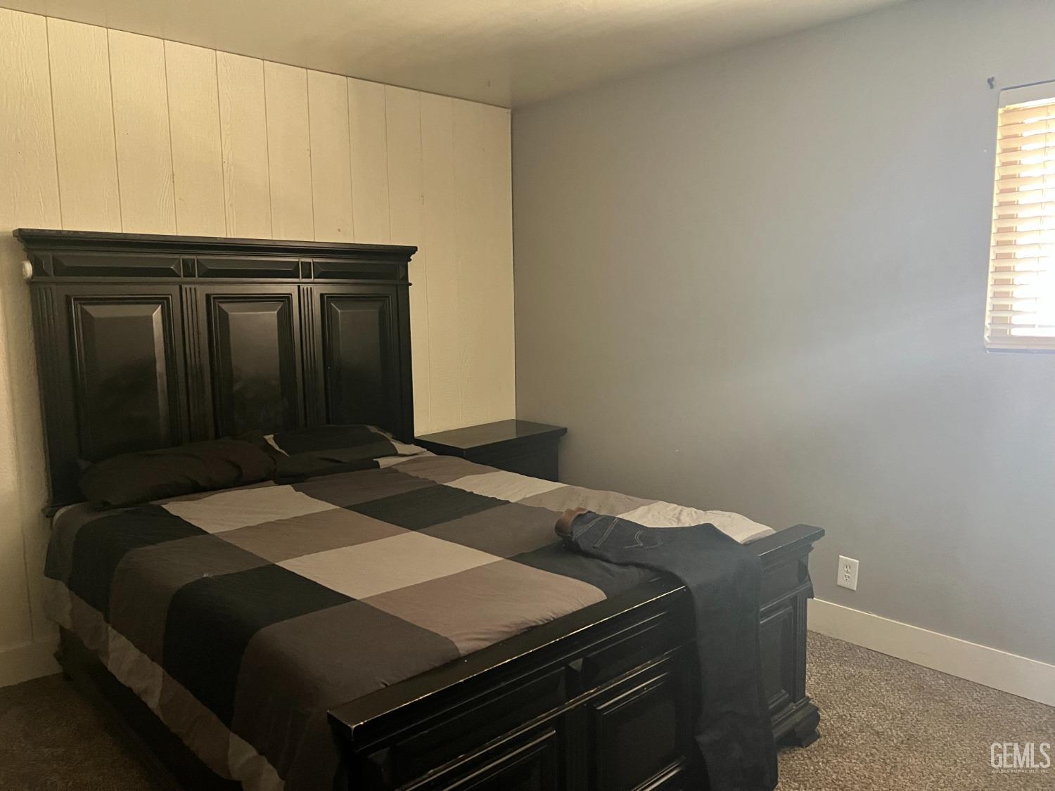 Undisclosed Address Tehachapi, CA 93561 - Photo 14 of 22 a bedroom with a bed and a window