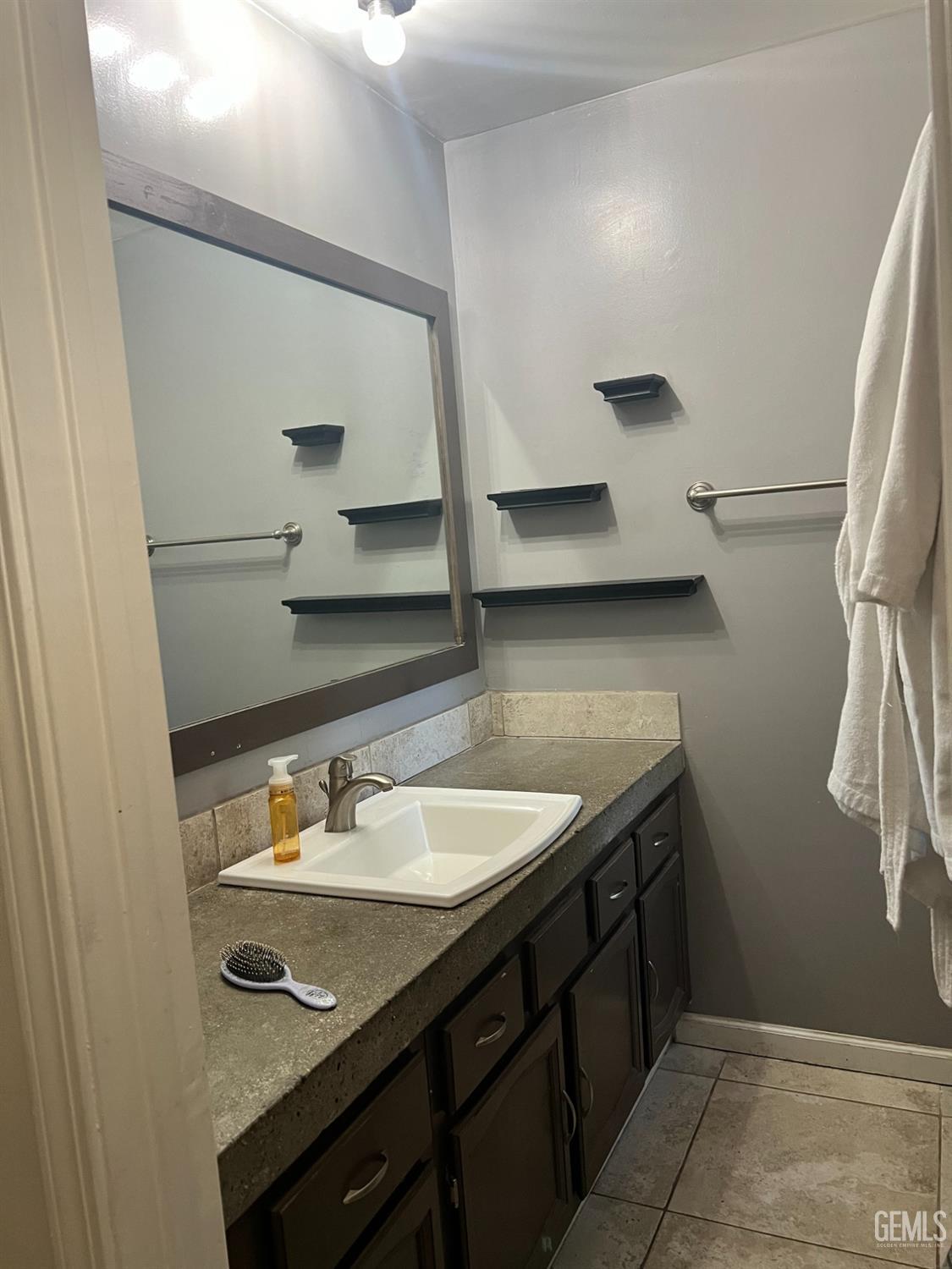 Undisclosed Address Tehachapi, CA 93561 - Photo 15 of 22 a bathroom with a sink and a mirror