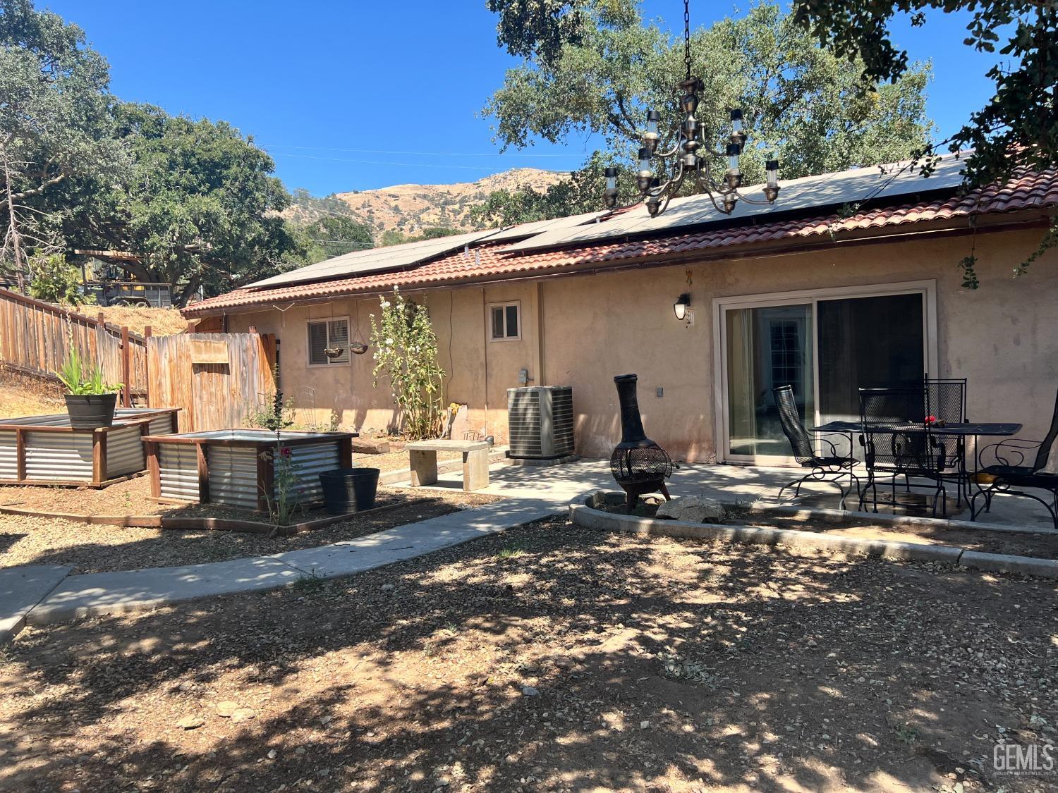 Undisclosed Address Tehachapi, CA 93561 - Photo 3 of 22 a front view of a house with patio