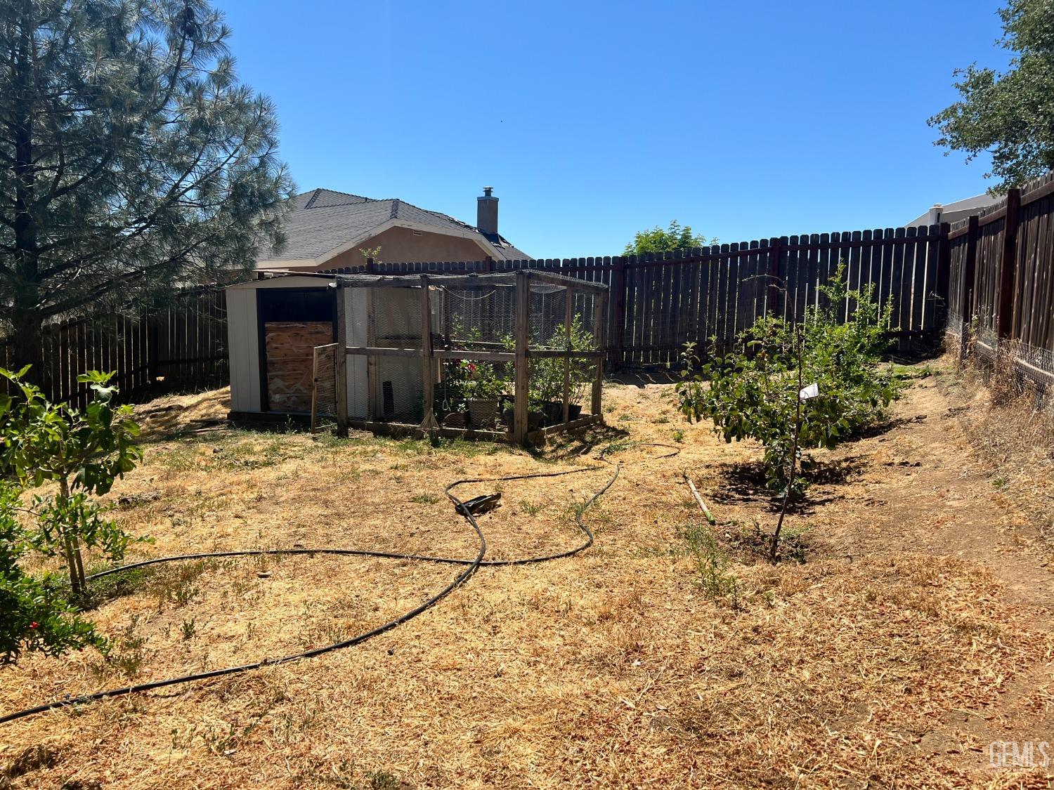 Undisclosed Address Tehachapi, CA 93561 - Photo 4 of 22 a view of a chairs and tables in the back yard of the house