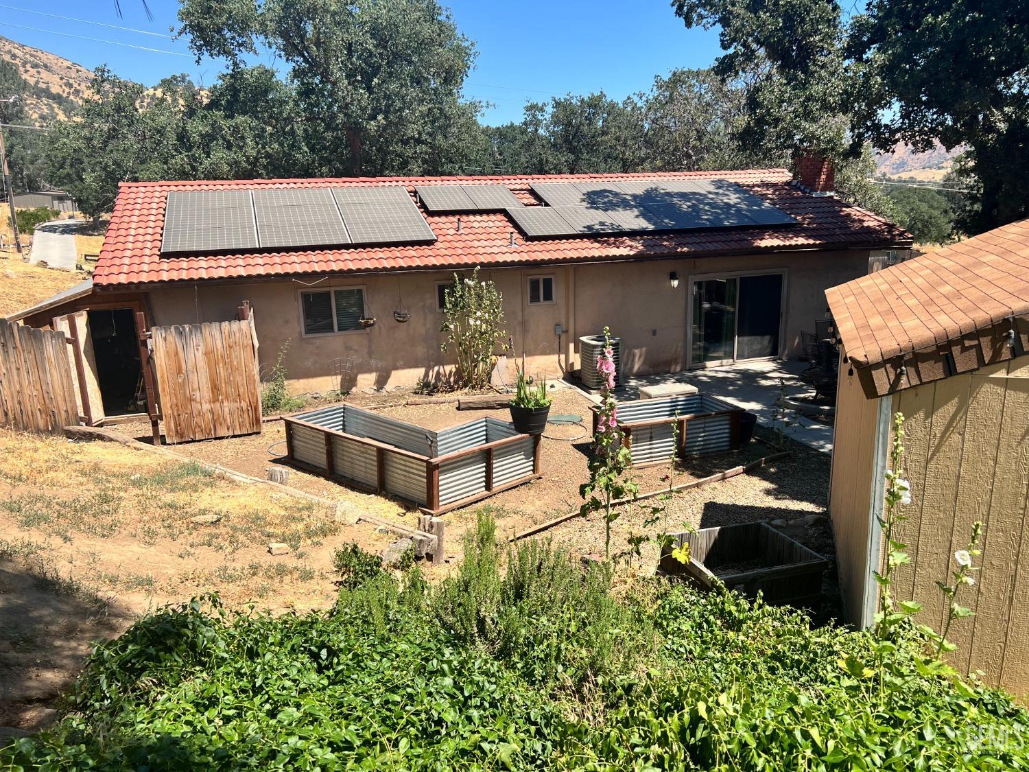 Undisclosed Address Tehachapi, CA 93561 - Photo 5 of 22 a view of a house with pool and chairs