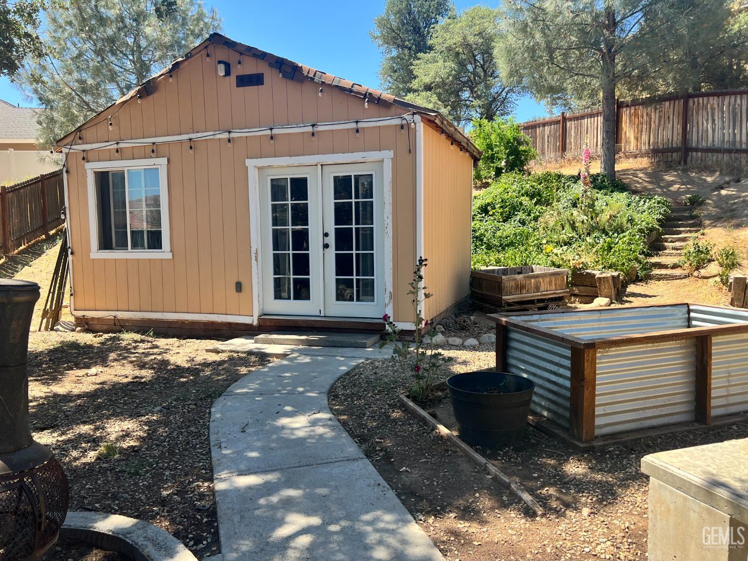 Undisclosed Address Tehachapi, CA 93561 - Photo 6 of 22 a front view of a house with a yard