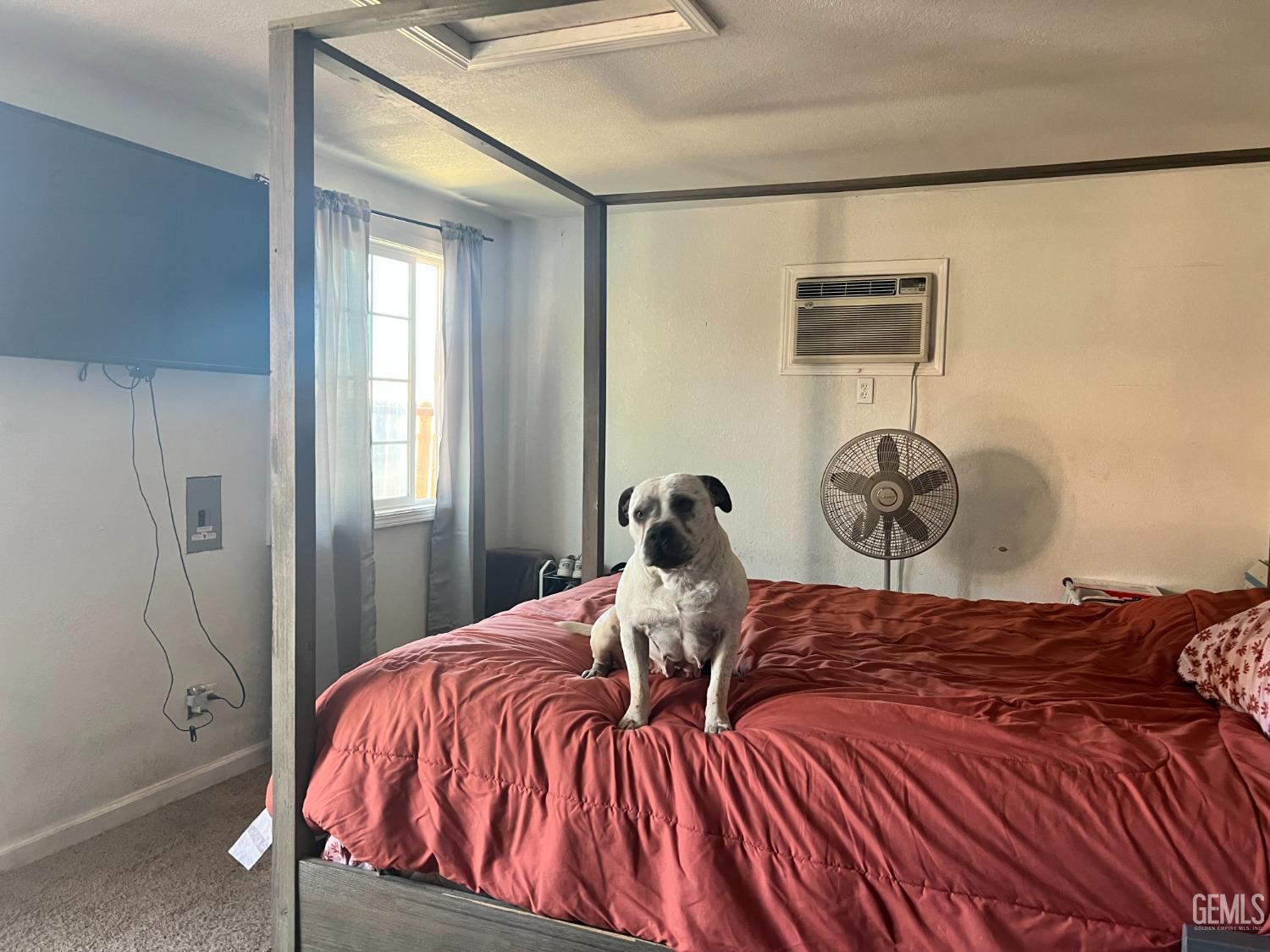 Undisclosed Address Tehachapi, CA 93561 - Photo 7 of 22 a bedroom with a bed and a window