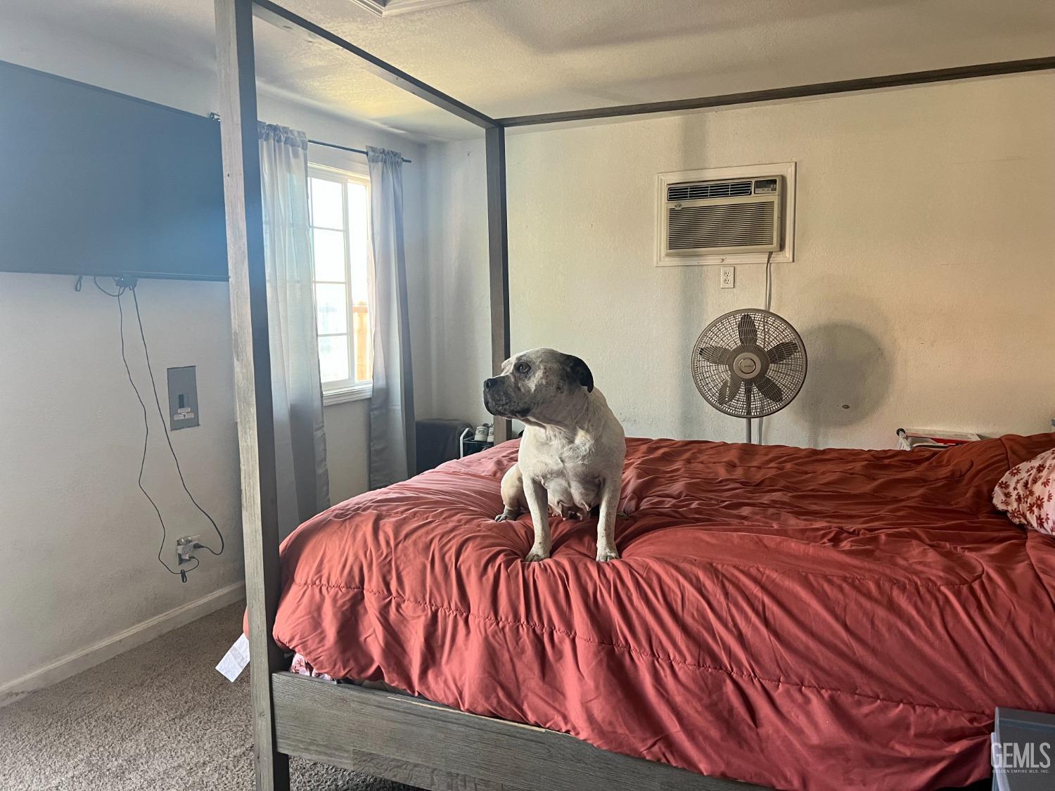 Undisclosed Address Tehachapi, CA 93561 - Photo 8 of 22 a bedroom with a bed and painting on the wall