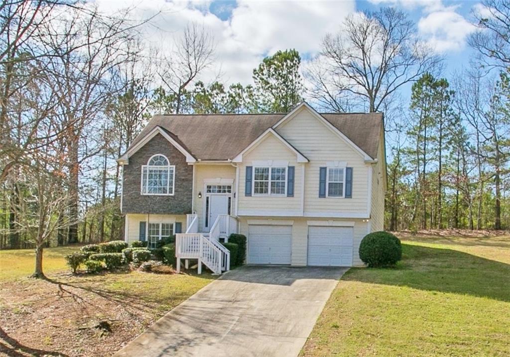 3345 Echo Falls Court Villa Rica, GA 30180 - Photo 1 of 1 a view of a white house with a yard and potted plants
