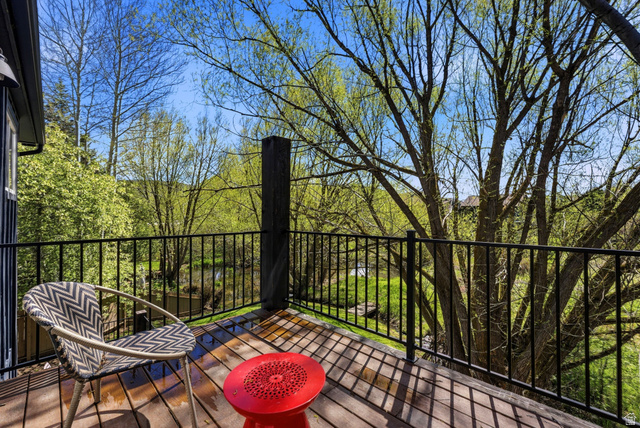 7935 Mustang Loop Road Park City, UT 84098 - Photo 51 of 60 Outdoor balcony featuring wood-finish decking and black metal railings