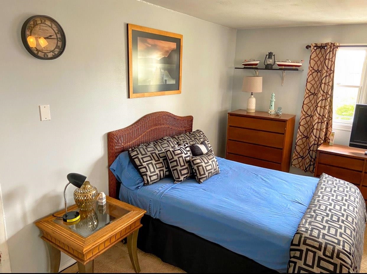 210 South Railroad Avenue Rio Grande, NJ 08242 - Photo 16 of 36 a bedroom with furniture and a wooden floor