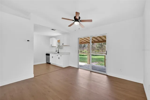 a view of a kitchen with a sink and a window